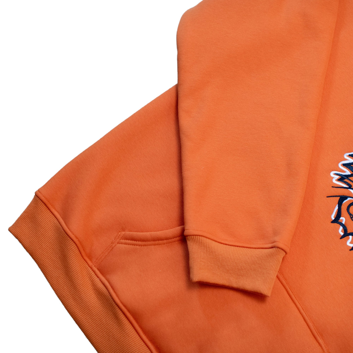 Squatchfuzz Tiger Hoodie detail showing orange fabric and tiger design on the Bigfoot hoodie.